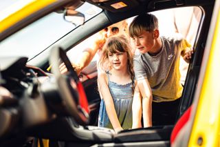 Children Looking In Honda Civic At Outdoor Vehicle Display