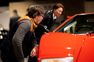 Visitors looking at Lamborghini Countach at Haynes Motor Museum